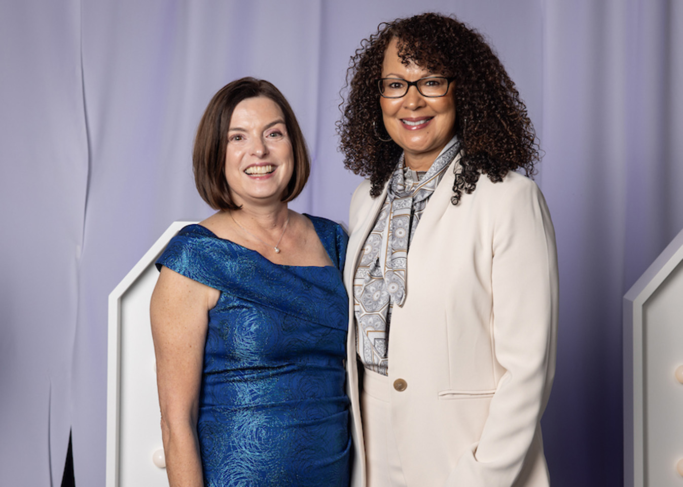 Rose Washington-Jones is presented with a blue vase as a Vision Dinner 2025 honoree.